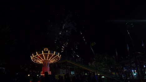 fireworks at fair with carousel