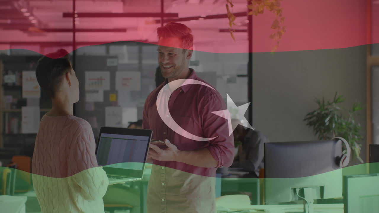 Discussing work in office, two colleagues with Azerbaijan flag animation overlay