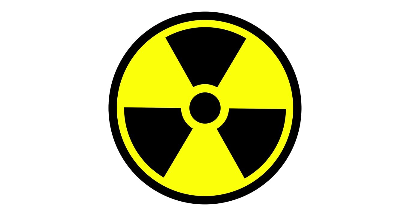 Símbolo animado de advertencia de radiación con efecto parpadeante. Un trébol negro sobre un círculo amarillo parpadea para indicar peligro radiactivo, alerta de seguridad y advertencia de riesgo nuclear.