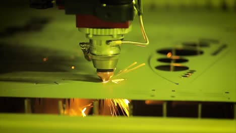 CNC-Laser-cutting-of-metal-in-slow-motion,-modern-industrial-technology.