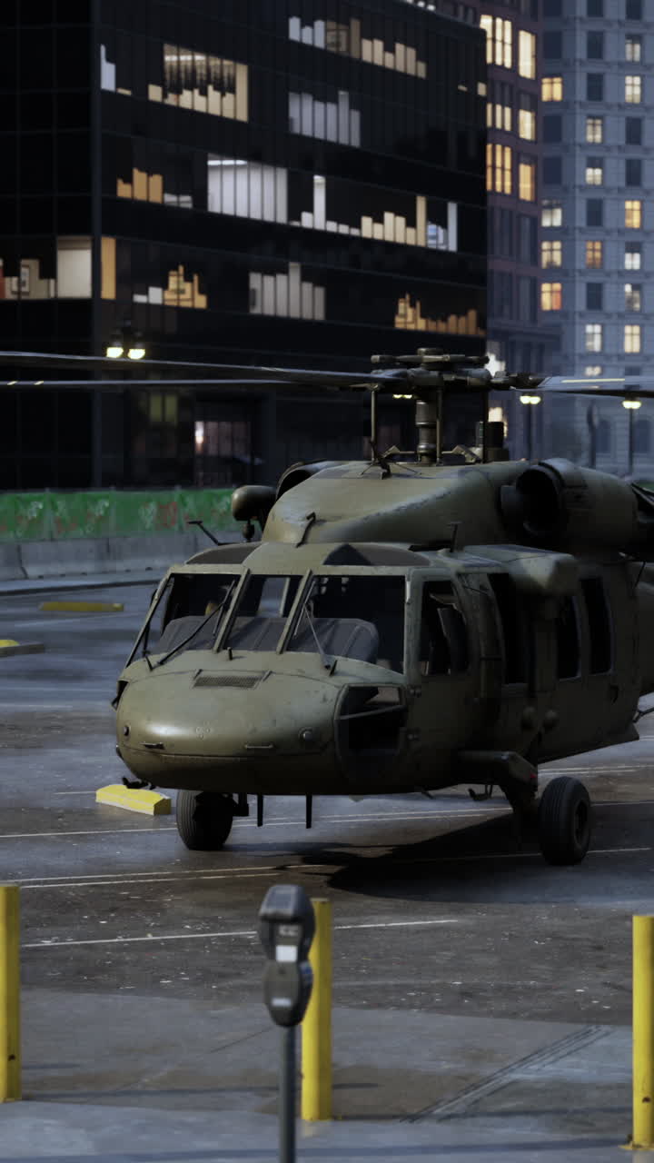 Black Hawk Helicopter in City Parking Lot at Night