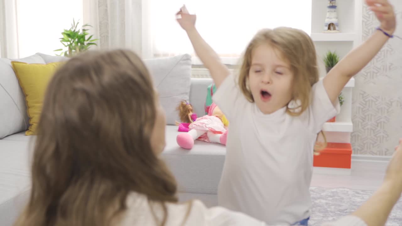Child girl hugging her mother in slow motion.