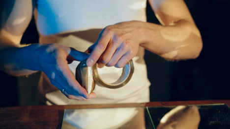 drug dealer packs a package with heroin. concept of drug abuse. social problems