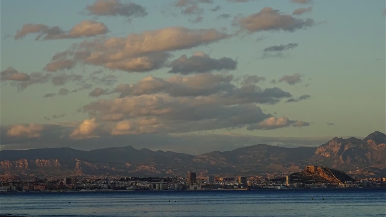 City Skyline with Mountains and Sea