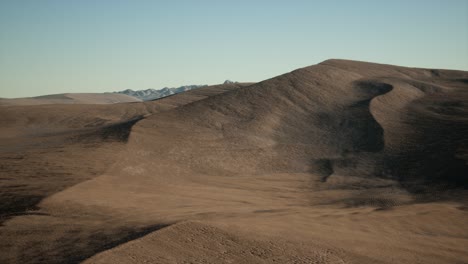 aerial view on big sand dunes in sahara desert at sunrise