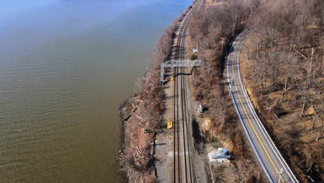 aerial drone footage of the amtrak hudson line in the hudson valley in new york during early spring