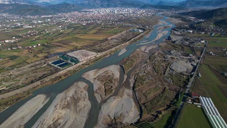 landfill and sand mining industries destroy the river and the surrounding environment in elbasan, albania