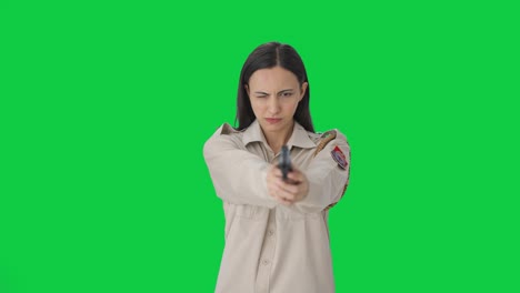 Indian-female-police-officer-aiming-handgun-on-someone-Green-screen