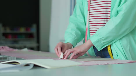 dressmaker working in her studio.