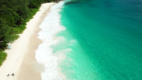 -Mahe-Seychelles-slow-flying-drone-on-spectacular-beach,-amazing-weather,-clear-water