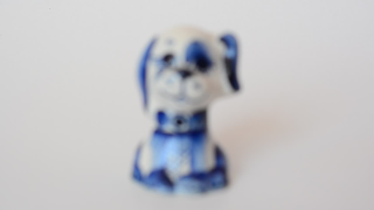Shooting of a figurine of a dog. Shooting of a figurine