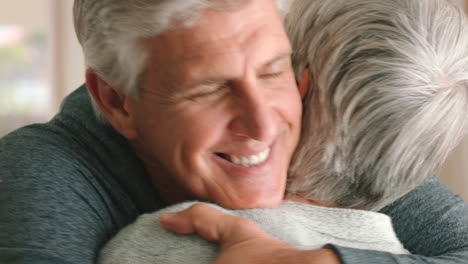 Mature-couple,-hug-or-love-bond-in-house-living