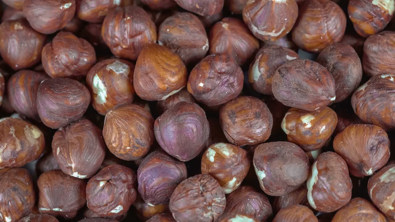 avelãs em fundo - vídeo rotativo e em loop