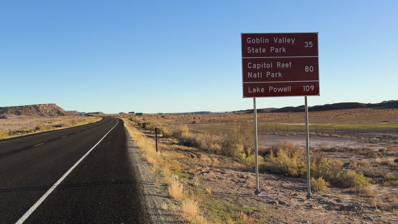 Sign on the road direction to Goblin Valley State Park in USA.