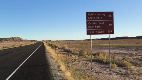sign on the road direction to goblin valley state park in usa.