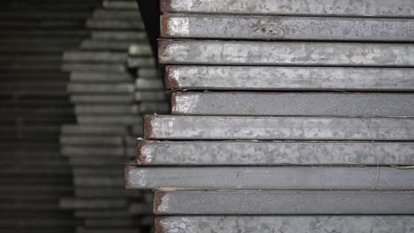 metal recyclables are neatly arranged. appearance is old. truck shot from right to left.