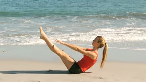 Attractive-woman-working-out-on-the-beach-