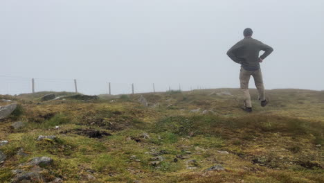 a man dancing on the hill of conor pass ireland
