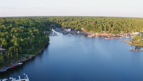 aerial view of a calm lake marina at sunset