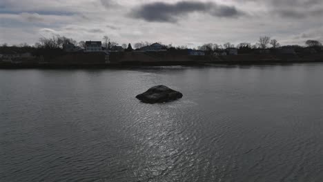 an aerial view of the calm waters of the long island sound off long island, ny on a cloudy day