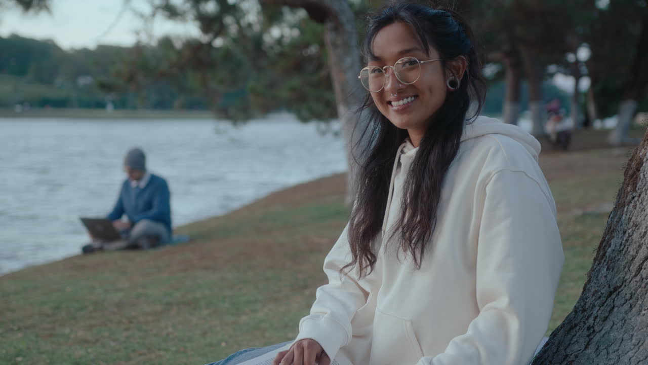 Smiling Asian Girl Posing on Camera in the Park