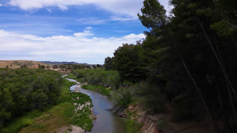 Flowing-mountain-river-in-Estepona-mountains,-aerial-view