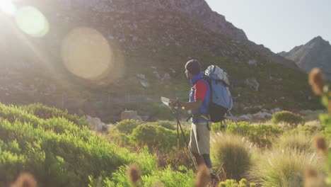 Mixed-race-man-with-prosthetic-leg-hiking-in-nature