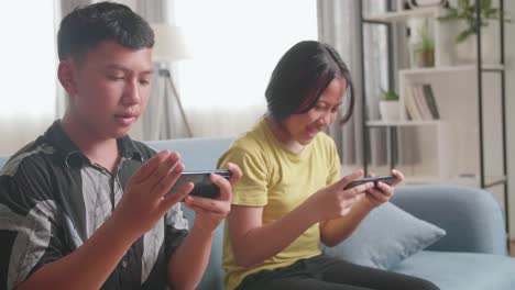 children playing games on mobile phones