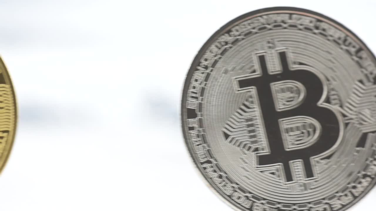 Tracking slow motion shot of front bit coins