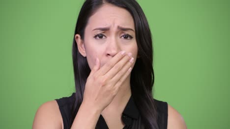 young beautiful asian businesswoman looking shocked