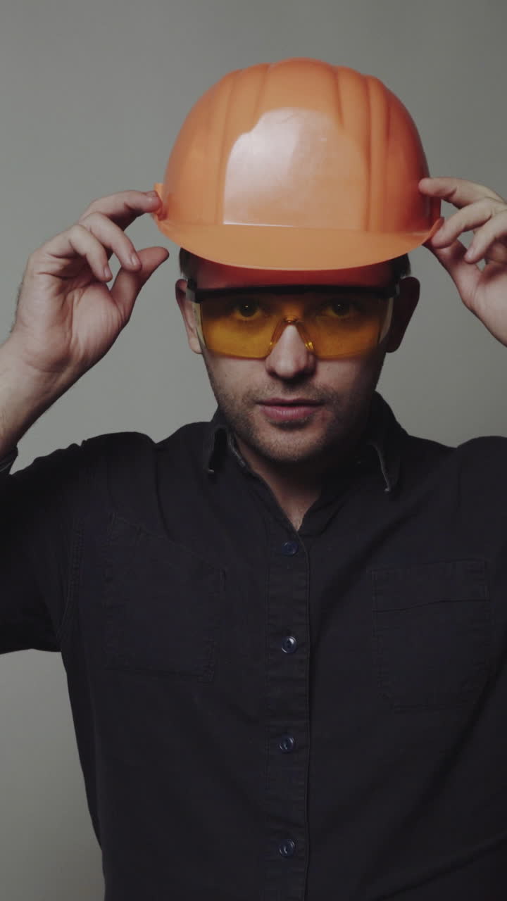 Concept of male engineer. Civil construction worker, builder, architect on gray background