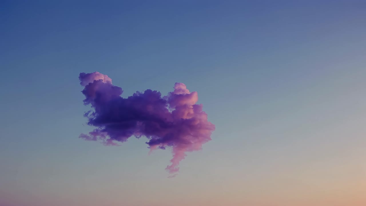 A single purple cloud floats against a gradient sky at sunset, captured from a low-angle