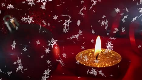 copos de nieve cayendo contra la vista de cerca de la joya de navidad roja y la lámpara encendida