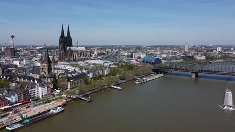 aerial riverfront cityscape of cologne city landmarks with ships on river rhine