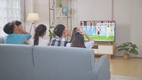 friends watching soccer on tv