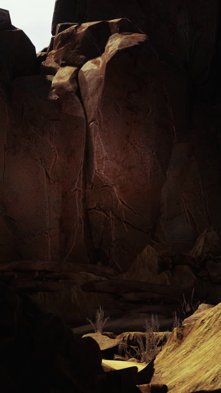 un cañón rocoso con una luz brillando en el suelo