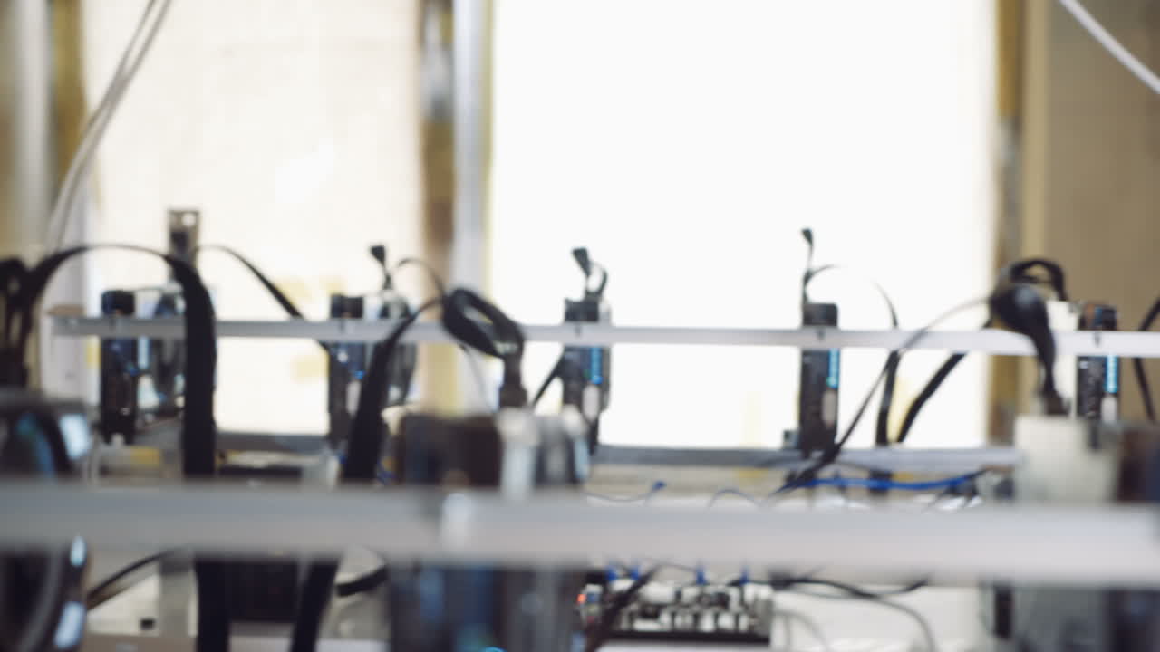Man checks the temperature of the graphics cards on the computer. Bitcoin cryptocurrency mining farm