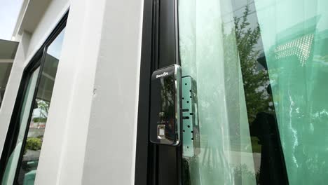 black modern fingerprint scan door, close up, no people