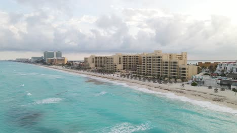 Aerial-View-Of-Luxury-Hotel-Zone-And-Ocean-In-Cancun,-Mexico---drone-shot