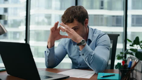 Man-saying-goodbye-video-call-sending-air-kiss-at-office-laptop-close-up.