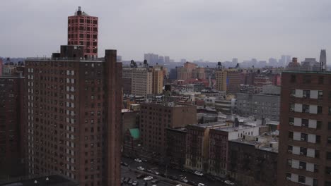 stationary shot from rooftop view of brick buildings as far as the eye can see in manhattan valley new york city, new york