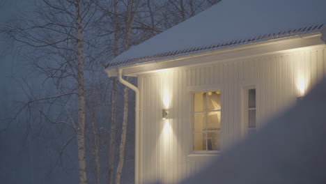 outdoor light lamps on house exterior in snowy winter weather