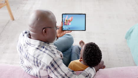 african american grandfather, grandson and tablet for online shopping, slow motion