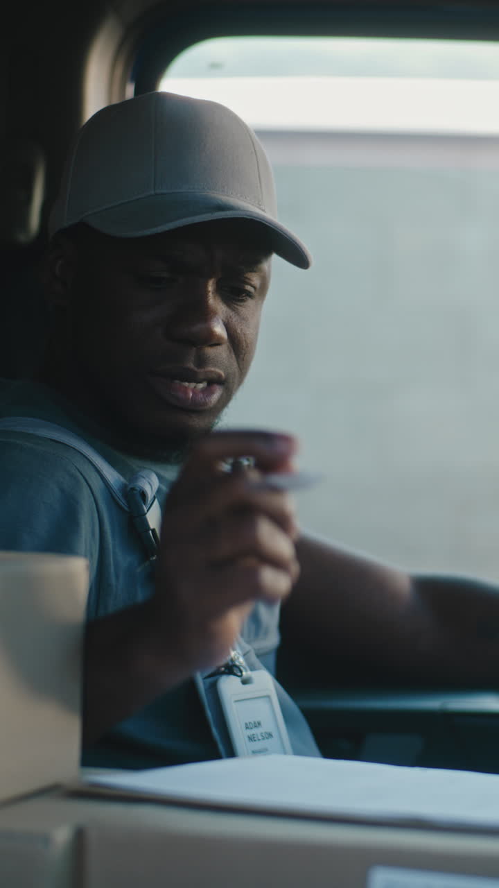 Delivery Driver Working and Pensive in Truck
