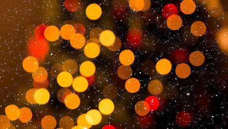 animation of snow falling over blurred christmas lights