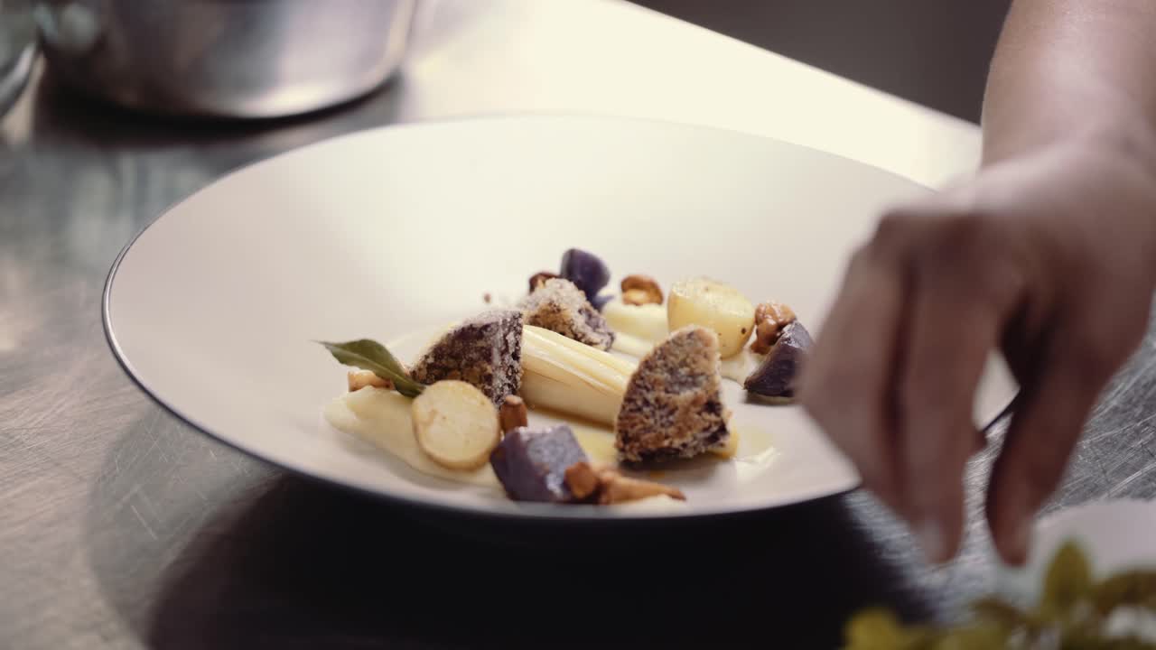 Hyper lapse of chef preparing a dish. cinematic time lapse of Fine dining dish being prepared. Motorized slider time lapse of course being decorated