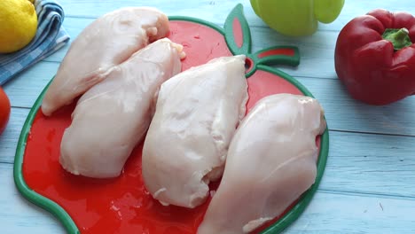 raw chicken breast with vegetables