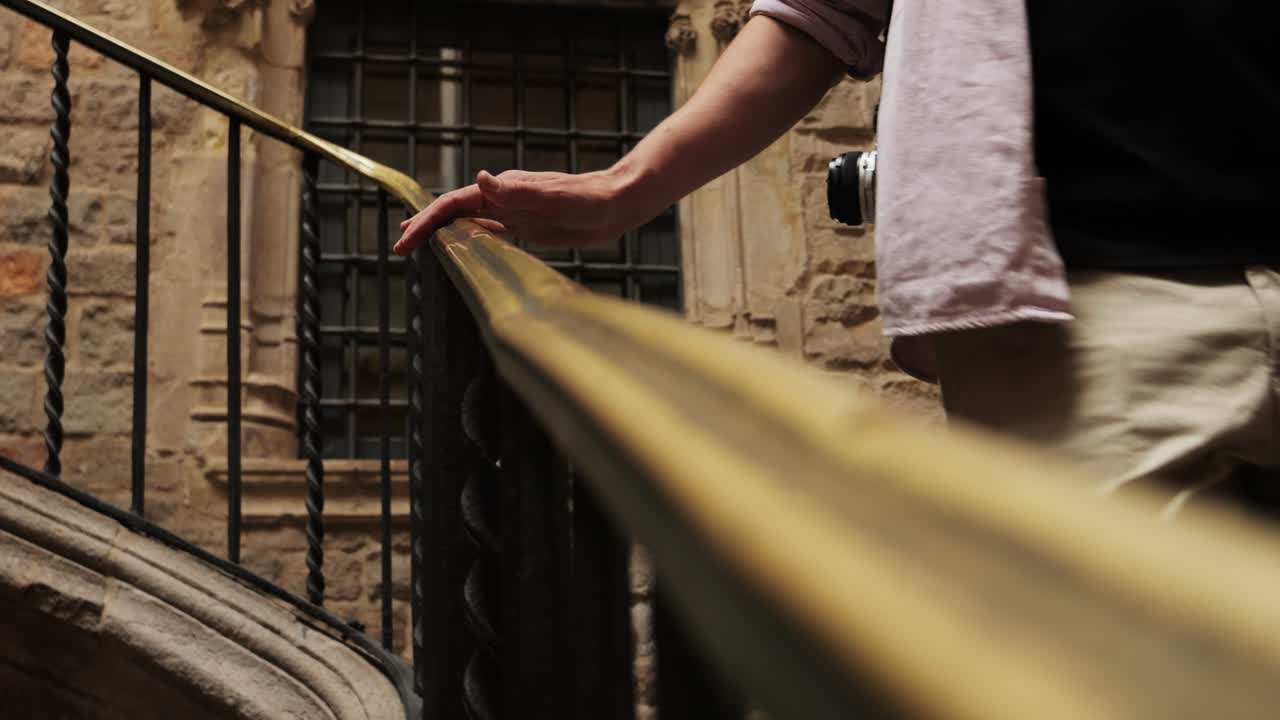 Happy tourist man in Barcelona, Spain. Vacation exploring interesting places to travel, student vacation, young man portrait walking in gothic square, old european city