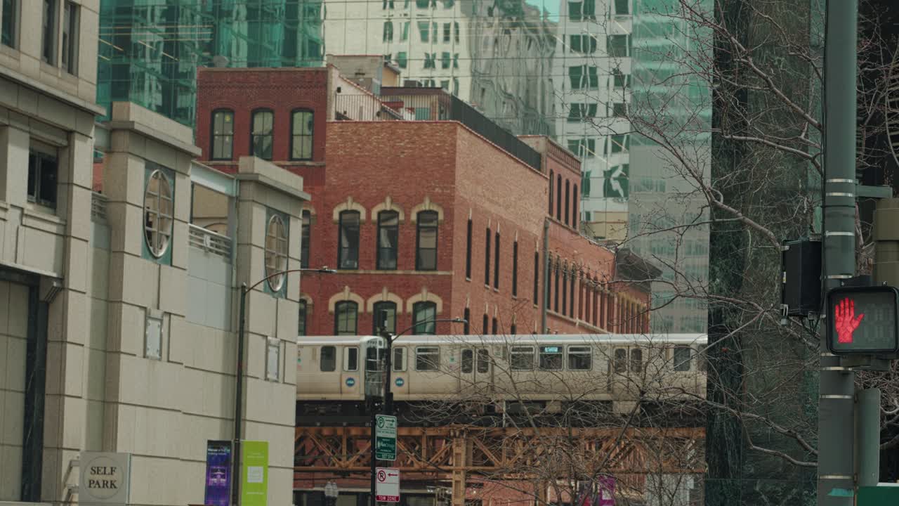Vintage Red Complex Faces Above-Ground Railway in Chicago Thriving Metropolis