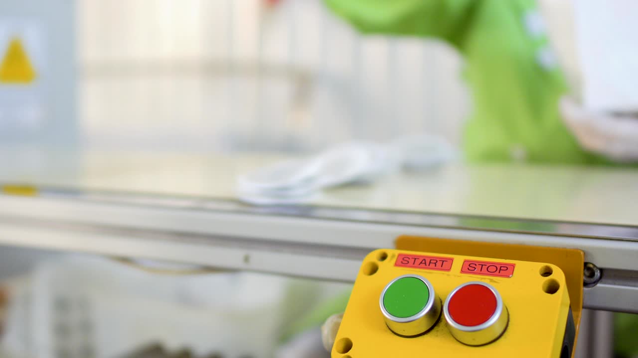 Worker stops conveyor belt